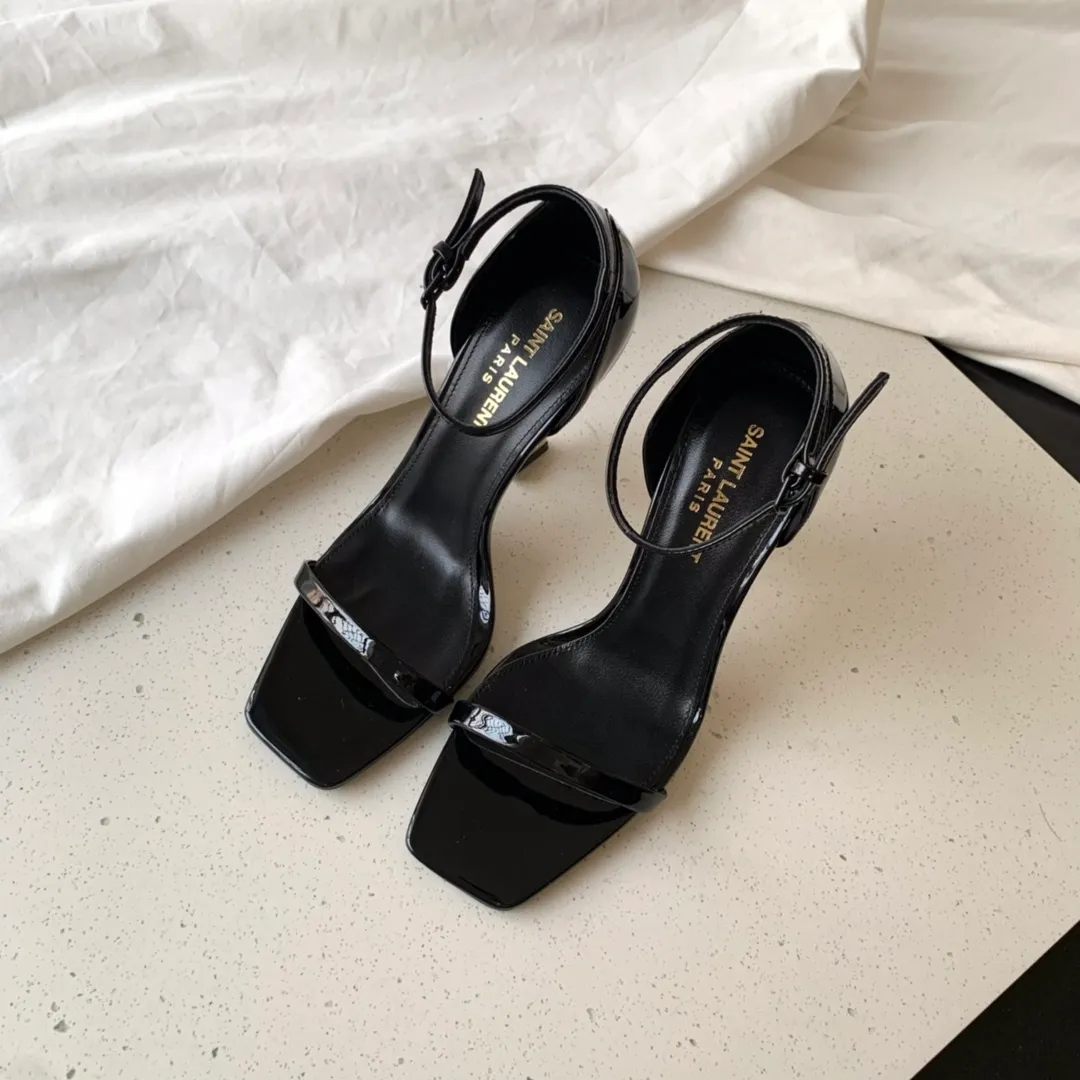 👟👟Ex-factory price 520 SAINT LAUREN*" Saint Laurent YSL classic one-word high-heeled sandals with logo lettering. Only YSL understands women's hearts best and does not accept refutation. It is a super invincible feminine artifact and a must-have for women (✅Z products are fully customized, with self-molded toe hardware, perfect consistency) Upper: Customized imported cotton silk fabric/Imported calf patent leather Lining: Imported 🐑Sheep leather Sole: Imported genuine leather outsole Heel height: 9cm Color: black lacquer with silver, black with gold Size: 35-39 (full set of packaging)
